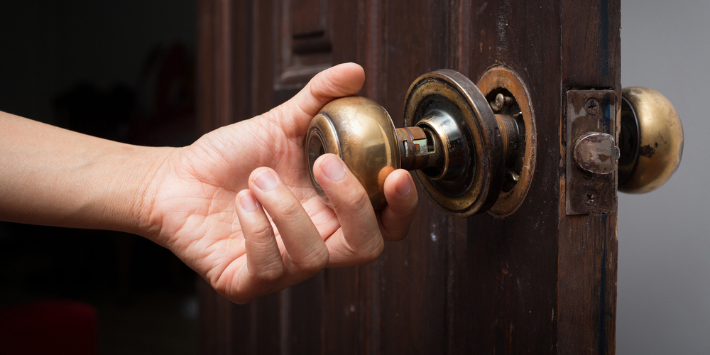Fort Worth locksmith securing storm-damaged door