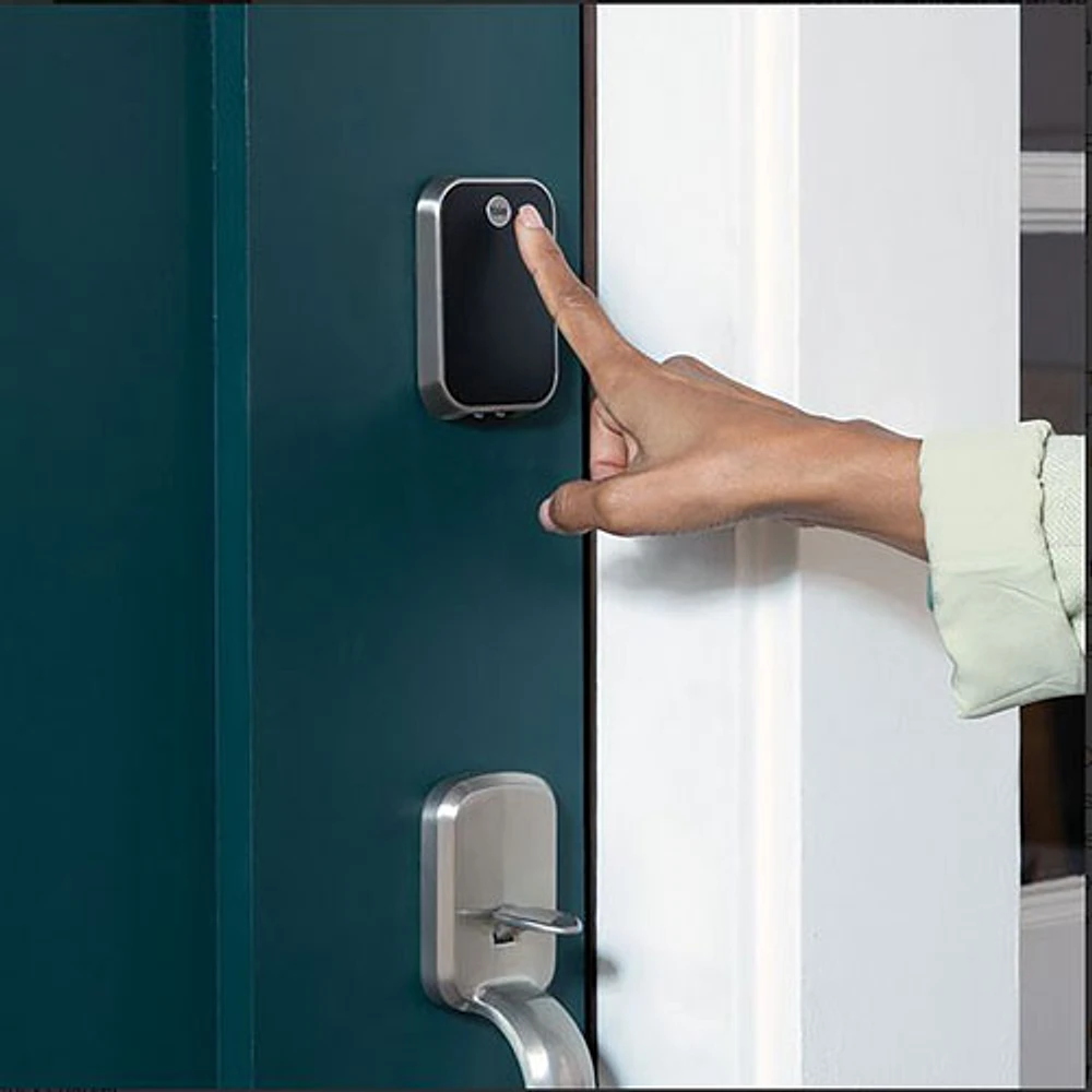 Close-up of a smart lock installed on a modern residential door