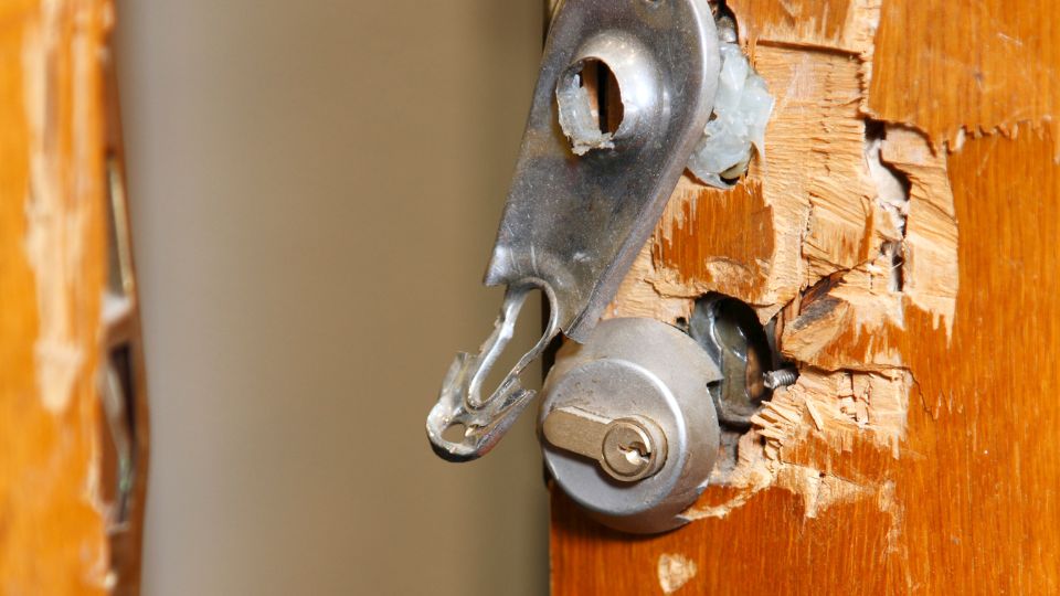 faulty lock on a front door showing wear and corrosion