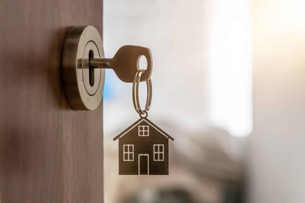 Rekeying a home lock by a residential locksmith in Arlington showing rekeying process and tools.