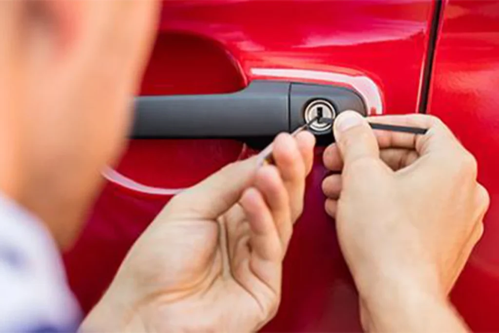 Car locksmith helping driver unlock a vehicle safely